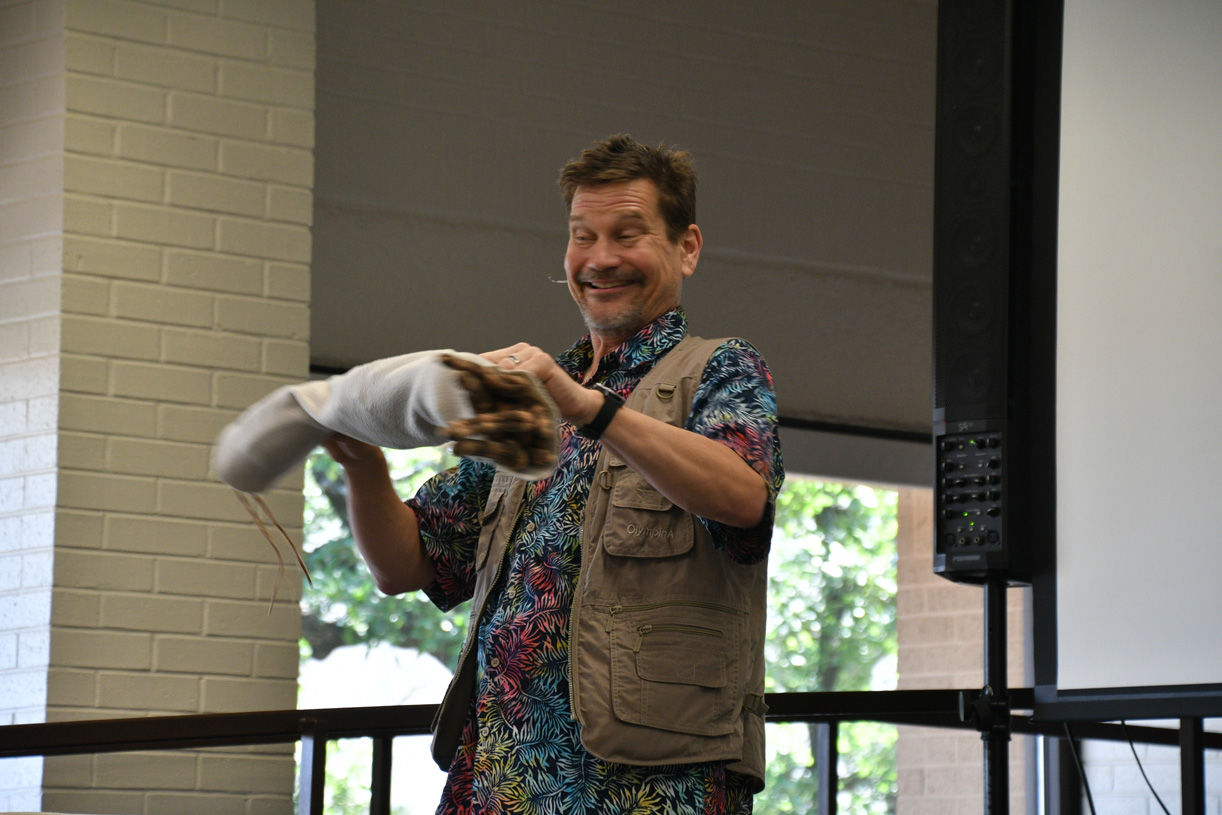 Singing zoologist Lucas Miller visits Bryan library